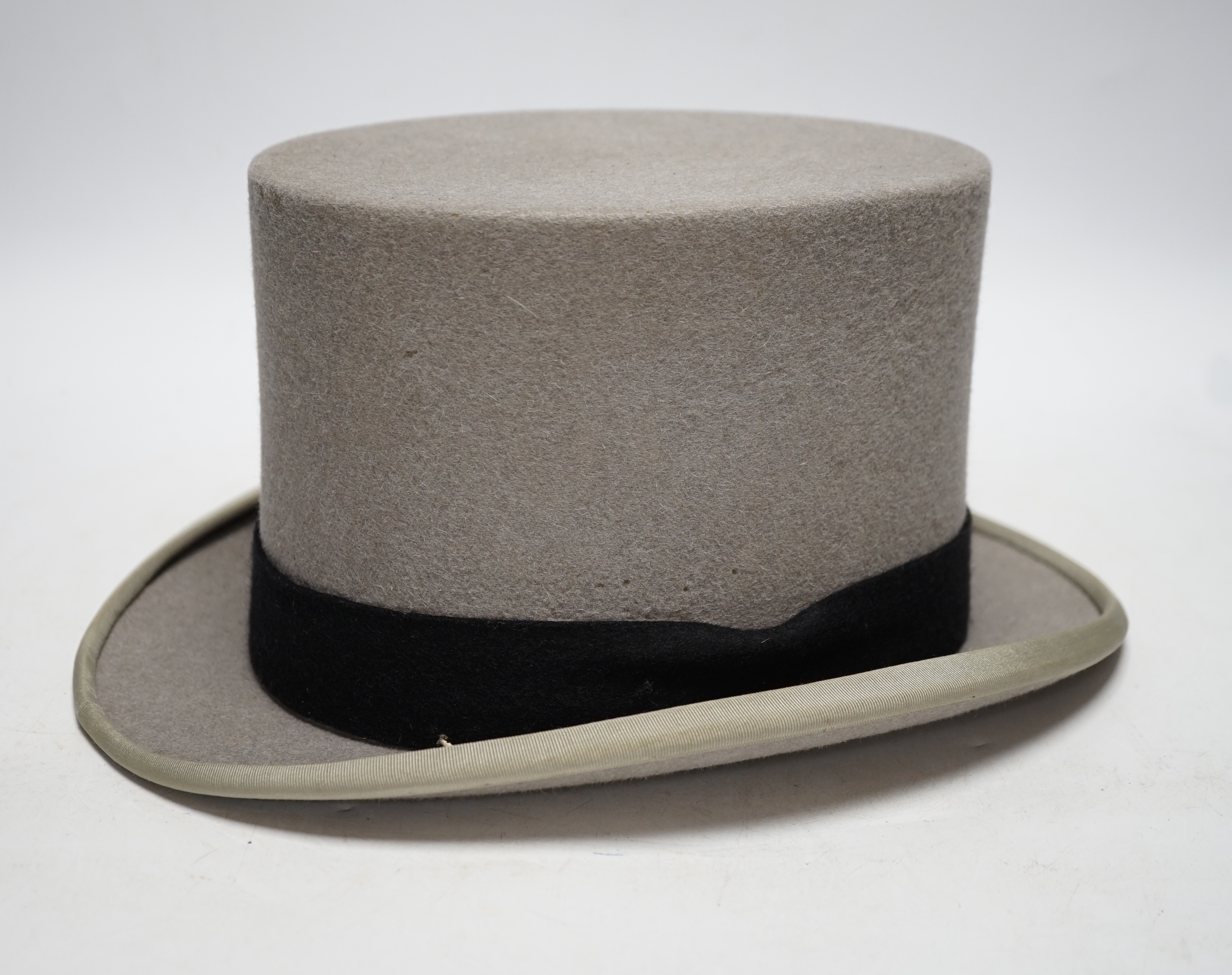 A Moss Bros grey top hat in Harrods box